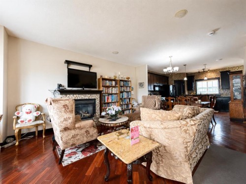 288 Rainbow Falls Drive, Chestermere, AB - Indoor Photo Showing Living Room With Fireplace