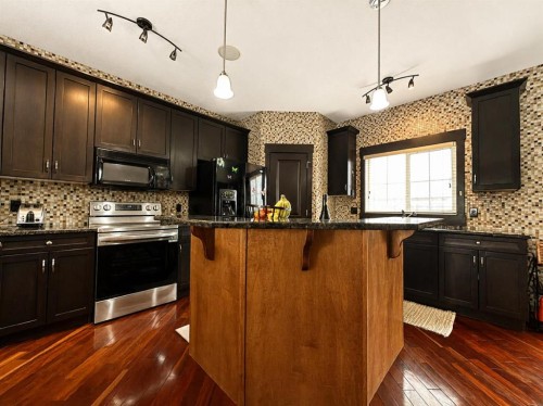 288 Rainbow Falls Drive, Chestermere, AB - Indoor Photo Showing Kitchen