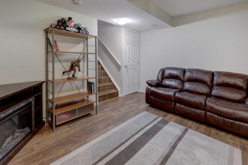 158 Everhollow Heights Sw, Calgary, AB - Indoor Photo Showing Living Room With Fireplace
