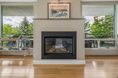 303-837 2 Avenue Sw, Calgary, AB - Indoor Photo Showing Living Room With Fireplace