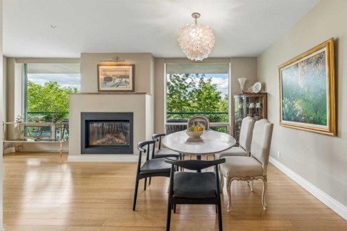 303-837 2 Avenue Sw, Calgary, AB - Indoor Photo Showing Dining Room With Fireplace