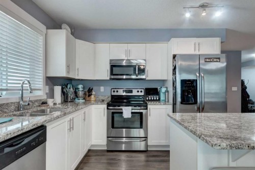 2114-755 Copperpond Boulevard Se, Calgary, AB - Indoor Photo Showing Kitchen With Stainless Steel Kitchen With Double Sink With Upgraded Kitchen