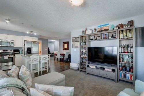 2114-755 Copperpond Boulevard Se, Calgary, AB - Indoor Photo Showing Living Room