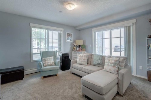 2114-755 Copperpond Boulevard Se, Calgary, AB - Indoor Photo Showing Living Room