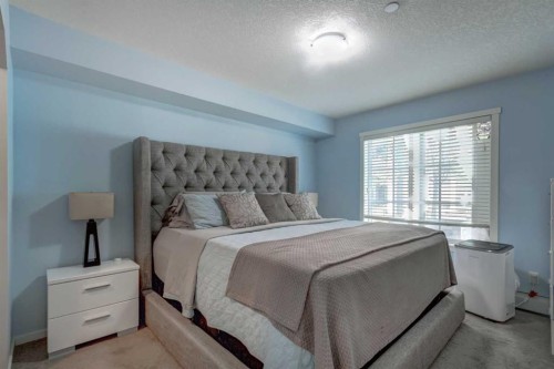 2114-755 Copperpond Boulevard Se, Calgary, AB - Indoor Photo Showing Bedroom