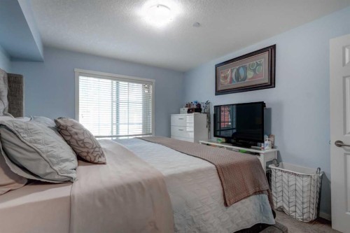 2114-755 Copperpond Boulevard Se, Calgary, AB - Indoor Photo Showing Bedroom