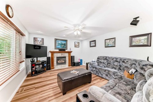 167 Fairways Close Nw, Airdrie, AB - Indoor Photo Showing Living Room With Fireplace