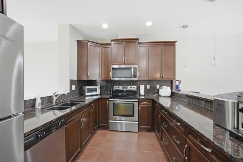 402 Wentworth Villas Sw, Calgary, AB - Indoor Photo Showing Kitchen With Stainless Steel Kitchen With Double Sink