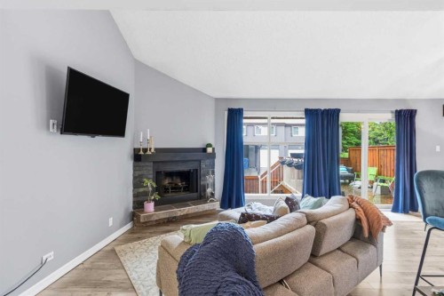 57-2225 Oakmoor Drive Sw, Calgary, AB - Indoor Photo Showing Living Room With Fireplace