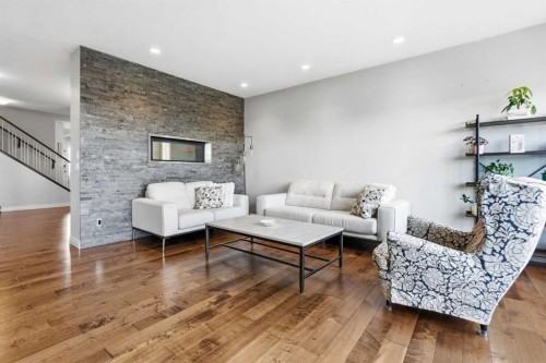127 Marquis Grove Se, Calgary, AB - Indoor Photo Showing Living Room With Fireplace