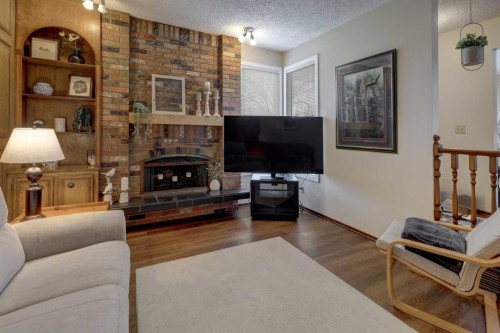108 Templeview Place Ne, Calgary, AB - Indoor Photo Showing Living Room With Fireplace