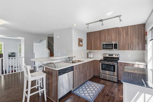 148 Cranarch Road Se, Calgary, AB - Indoor Photo Showing Kitchen With Double Sink