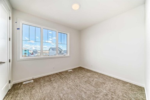 46 Verdure Place Sw, Calgary, AB - Indoor Photo Showing Other Room