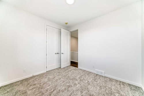 46 Verdure Place Sw, Calgary, AB - Indoor Photo Showing Other Room