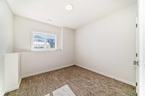 46 Verdure Place Sw, Calgary, AB - Indoor Photo Showing Other Room
