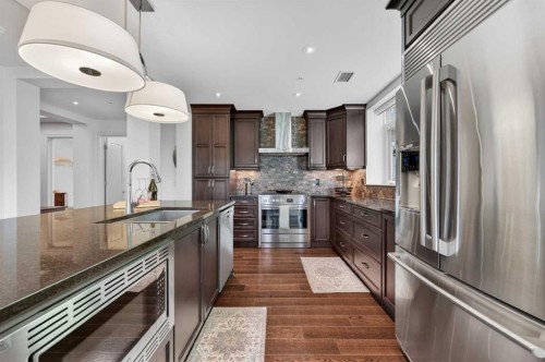 102-211 Quarry Way Se, Calgary, AB - Indoor Photo Showing Kitchen With Stainless Steel Kitchen With Upgraded Kitchen
