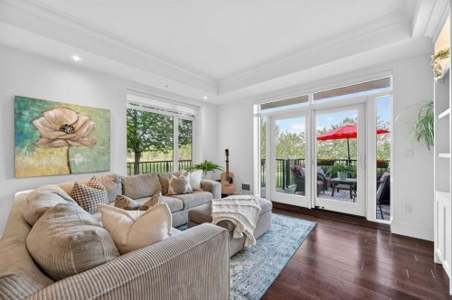 102-211 Quarry Way Se, Calgary, AB - Indoor Photo Showing Living Room