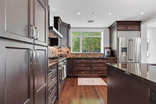 102-211 Quarry Way Se, Calgary, AB - Indoor Photo Showing Kitchen With Stainless Steel Kitchen With Upgraded Kitchen