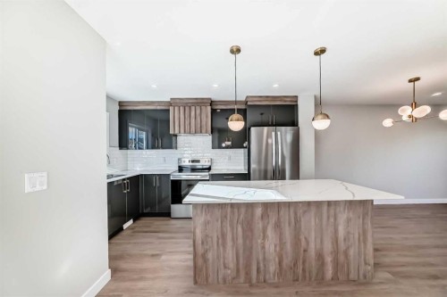 903 Clover Road, Carstairs, AB - Indoor Photo Showing Kitchen With Stainless Steel Kitchen With Upgraded Kitchen