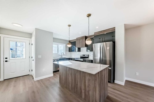 903 Clover Road, Carstairs, AB - Indoor Photo Showing Kitchen With Stainless Steel Kitchen With Upgraded Kitchen