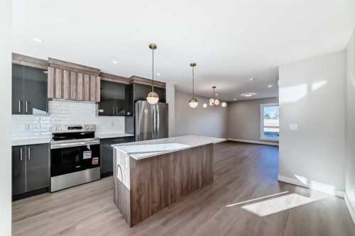 903 Clover Road, Carstairs, AB - Indoor Photo Showing Kitchen With Stainless Steel Kitchen With Upgraded Kitchen