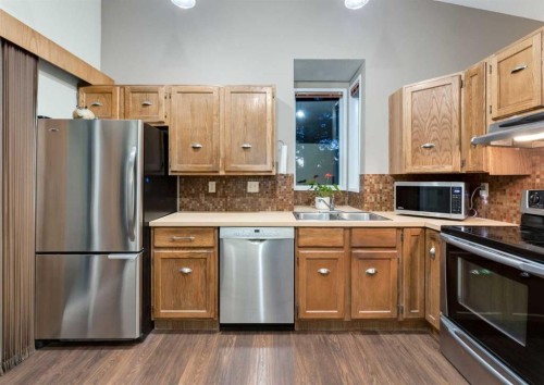 63 Brookpark Crescent Sw, Calgary, AB - Indoor Photo Showing Kitchen With Stainless Steel Kitchen With Double Sink