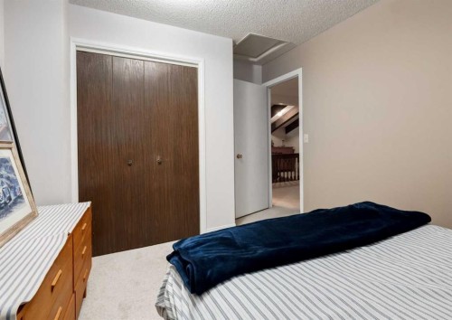 63 Brookpark Crescent Sw, Calgary, AB - Indoor Photo Showing Bedroom