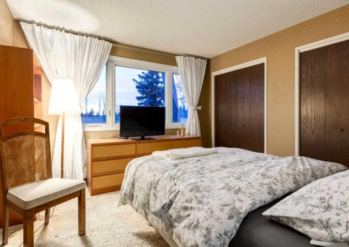 63 Brookpark Crescent Sw, Calgary, AB - Indoor Photo Showing Bedroom