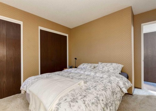 63 Brookpark Crescent Sw, Calgary, AB - Indoor Photo Showing Bedroom