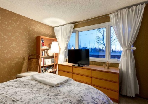 63 Brookpark Crescent Sw, Calgary, AB - Indoor Photo Showing Bedroom