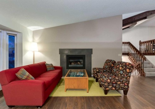 63 Brookpark Crescent Sw, Calgary, AB - Indoor Photo Showing Living Room With Fireplace