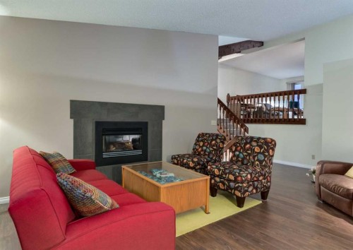 63 Brookpark Crescent Sw, Calgary, AB - Indoor Photo Showing Living Room With Fireplace
