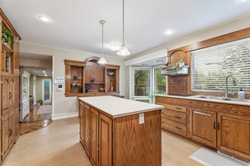 411 Wilderness Place Se, Calgary, AB - Indoor Photo Showing Kitchen With Double Sink