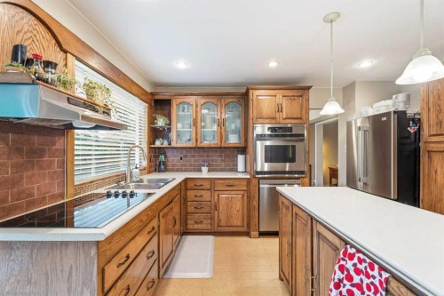 411 Wilderness Place Se, Calgary, AB - Indoor Photo Showing Kitchen With Double Sink