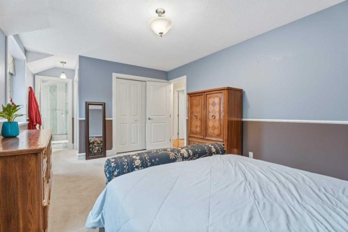 411 Wilderness Place Se, Calgary, AB - Indoor Photo Showing Bedroom