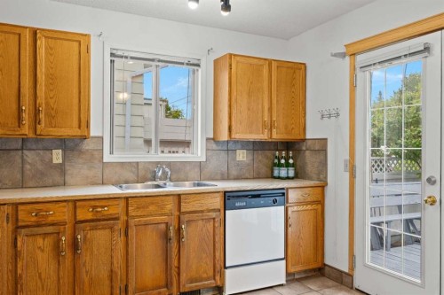 159 Shawinigan Drive Sw, Calgary, AB - Indoor Photo Showing Kitchen With Double Sink