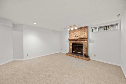 159 Shawinigan Drive Sw, Calgary, AB - Indoor With Fireplace