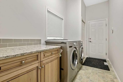 41 Cranston Drive Se, Calgary, AB - Indoor Photo Showing Laundry Room