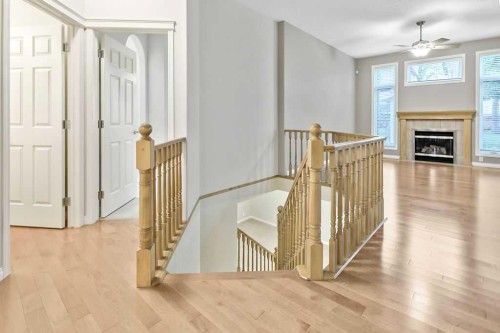 41 Cranston Drive Se, Calgary, AB - Indoor Photo Showing Other Room With Fireplace