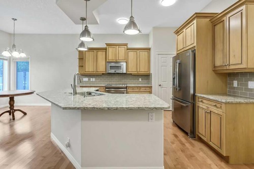 41 Cranston Drive Se, Calgary, AB - Indoor Photo Showing Kitchen With Double Sink With Upgraded Kitchen
