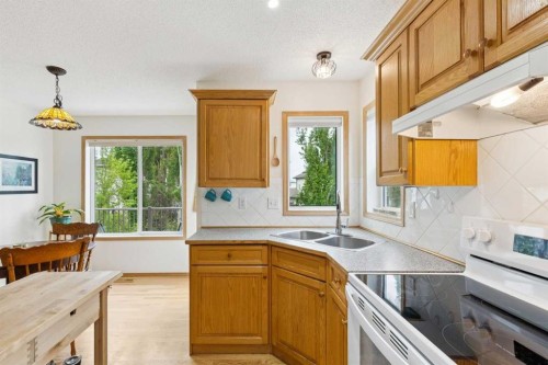 23 Tuscarora Close Nw, Calgary, AB - Indoor Photo Showing Kitchen With Double Sink