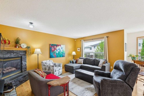 23 Tuscarora Close Nw, Calgary, AB - Indoor Photo Showing Living Room With Fireplace