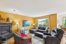 23 Tuscarora Close Nw, Calgary, AB  - Indoor Photo Showing Living Room With Fireplace 