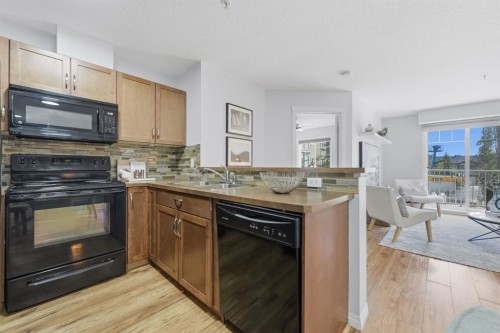 2223-115 Prestwick Villas Se, Calgary, AB - Indoor Photo Showing Kitchen With Double Sink