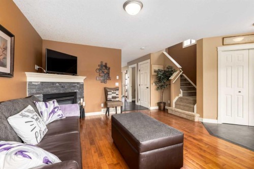 159 Cimarron Grove Crescent, Okotoks, AB - Indoor Photo Showing Living Room With Fireplace
