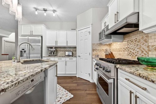 13 Cougar Ridge Circle Sw, Calgary, AB - Indoor Photo Showing Kitchen With Stainless Steel Kitchen With Double Sink With Upgraded Kitchen