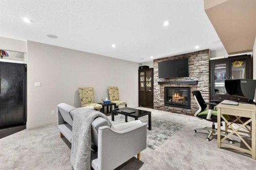 13 Cougar Ridge Circle Sw, Calgary, AB - Indoor With Fireplace