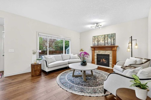 13 Cougar Ridge Circle Sw, Calgary, AB - Indoor Photo Showing Living Room With Fireplace