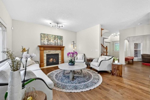 13 Cougar Ridge Circle Sw, Calgary, AB - Indoor Photo Showing Living Room With Fireplace