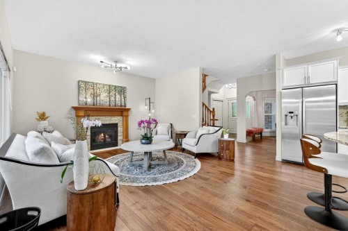 13 Cougar Ridge Circle Sw, Calgary, AB - Indoor Photo Showing Living Room With Fireplace